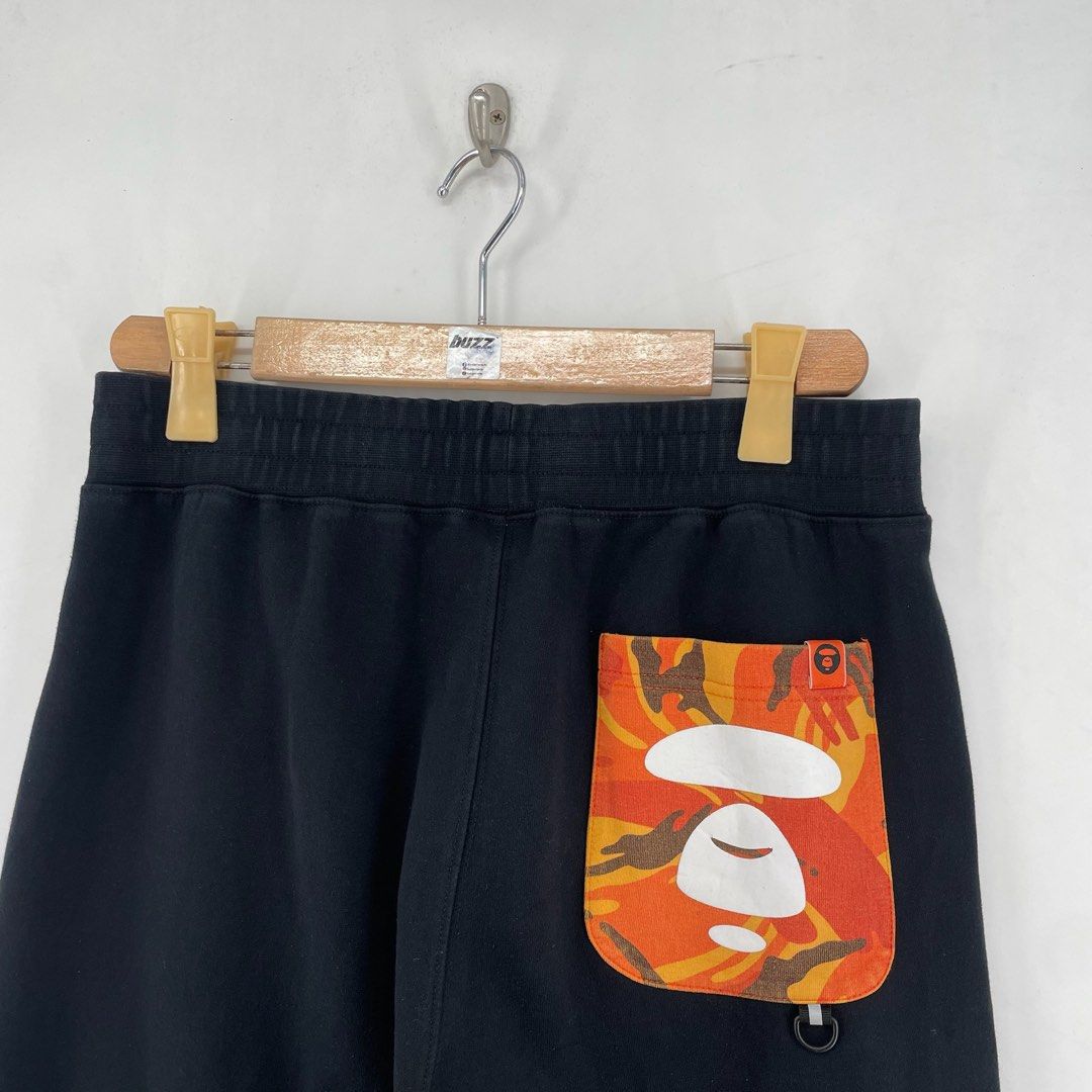 AAPE Orange Logo Jogger Pants (Category: Joggers) located in Manila. Submitted by buzz.garments (Listing ID 1467353040, Image 3). Description: Size: Medium on tag Dimensions(inches) -Waist/Width: 30”-40” (Strechable) -Hip: 22” -Front Rise: 15” -Thigh: 12” -Inseam: 25” -Outseam/Length : 36” -Leg Opening: 4” minor hairlines - color may vary due to lighting. please manage your expectations-minimal and unseen flaws must be considered..