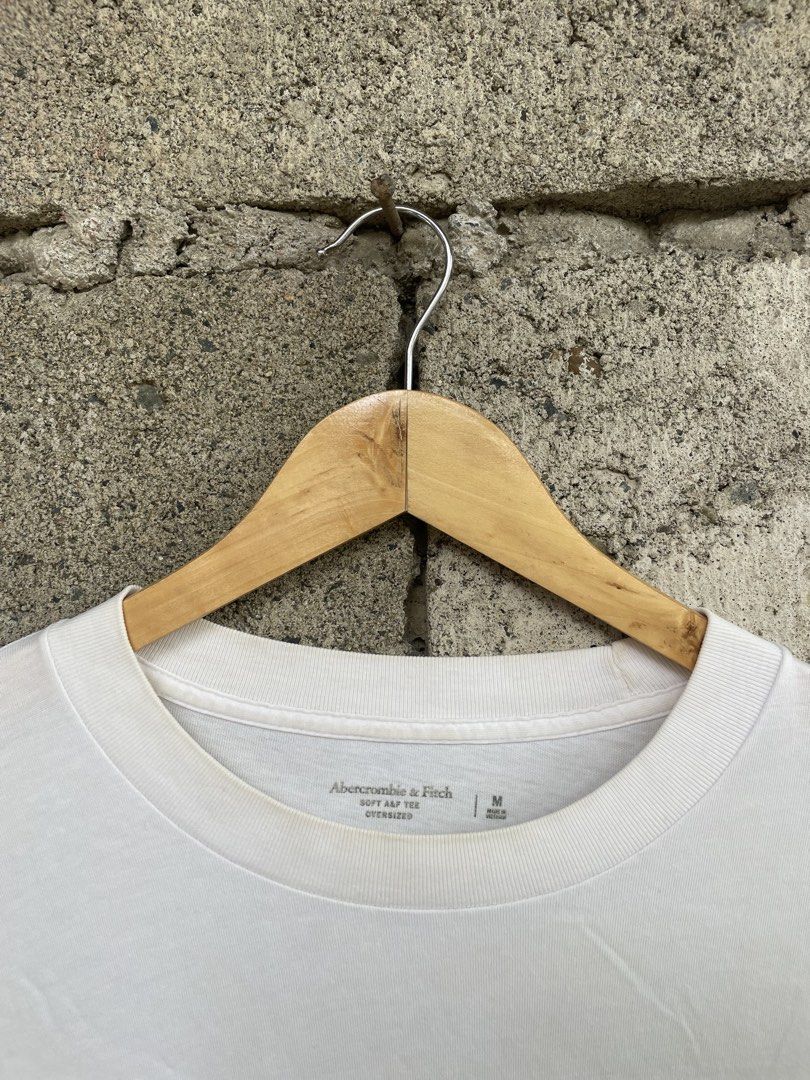 Abercrombie & Fitch Oversized Soft A&F Tee White Medium (Category: Tshirts & Polo Shirts ) located in Dagupan City. Submitted by thriftykiddo.ph (Listing ID 1467227481, Image 3). Description: - Brand: Abercrombie & Fitch - Color: White - Size: Medium (Oversized fit) - Material: Soft A&F signature tee fabric - Details: Small embroidered script logo on left chest, large bold block lettering graphic print on the back - Neckline/Sleeves: Crew necklin