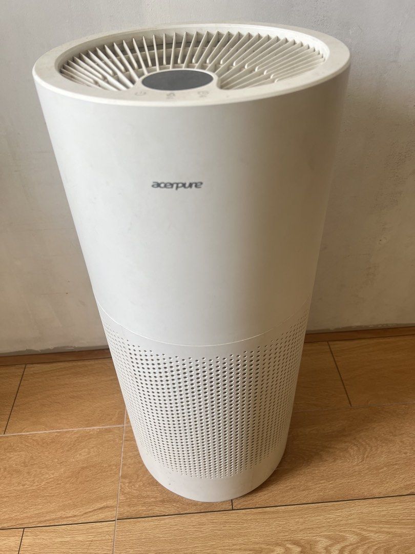 Acerpure Pro Air Purifier (Category: Air Purifiers & Dehumidifiers) located in General Trias. Submitted by lantiskumeo_9302 (Listing ID 1467189752, Image 3). Description: - Model: Acerpure Pro Air Purifier - Color: White, cylindrical design with perforated lower grille - Condition: Includes original brown cardboard box with handle and branding - Features: Keeps indoor air clean and fresh, operates quietly and efficiently - Setup: Simple plug-and-