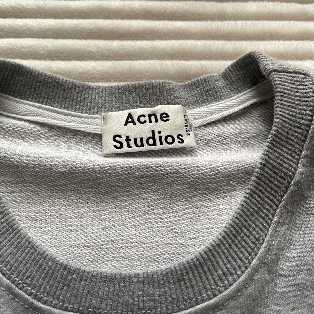 Acne Studios Grey Donut Embroidered Sweatshirt Size S (Category: Longsleeves) located in Muntinlupa City. Submitted by sza1123 (Listing ID 1467232849, Image 2). Description: - Brand: Acne Studios - Item: Grey Sweatshirt - Size: Small (S) - Material: 100% Cotton, Made in Portugal - Design: Detailed embroidered donut graphic on the chest - Details: Ribbed collar, cuffs, and hem with clean interior tags intact - Condition: Excellent, well-maintained