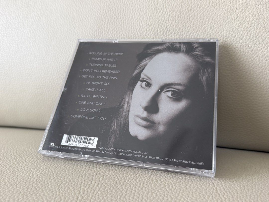 Adele 21 CD (Category: CDs & DVDs) located in Singapore. Submitted by meris (Listing ID 1467230339, Image 3). Description: - Artist & Album: Adele - 21 - Format: Audio CD in standard jewel case - Key Tracks: Rolling in the Deep, Someone Like You, Rumour Has It - Condition: Minor cracks on the jewel case, not on the CD.