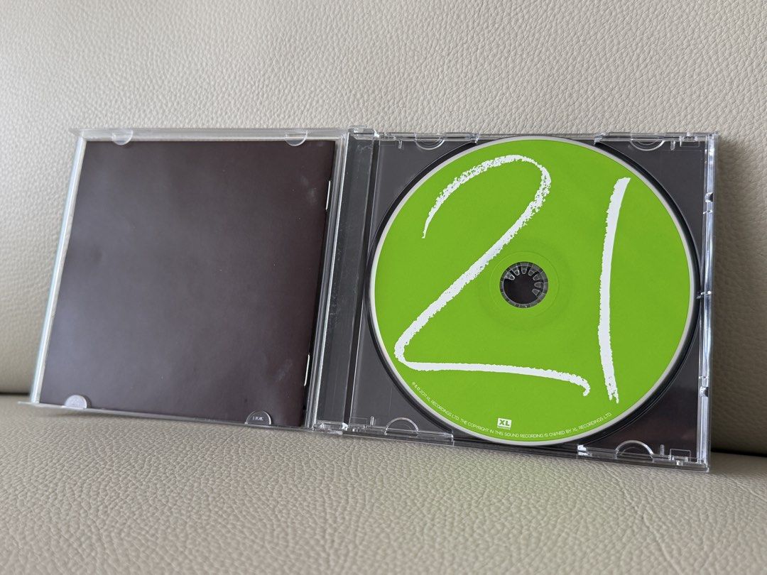 Adele 21 CD (Category: CDs & DVDs) located in Singapore. Submitted by meris (Listing ID 1467230339, Image 2). Description: - Artist & Album: Adele - 21 - Format: Audio CD in standard jewel case - Key Tracks: Rolling in the Deep, Someone Like You, Rumour Has It - Condition: Minor cracks on the jewel case, not on the CD.