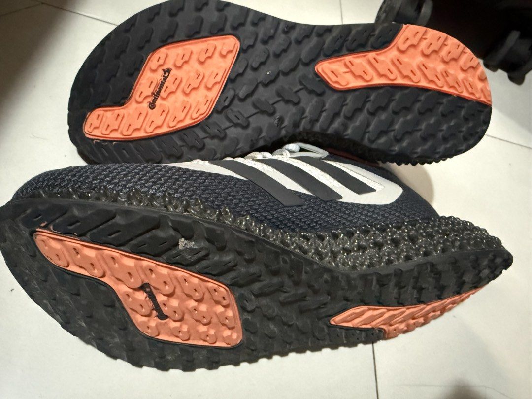Adidas 4D Runner Sneakers (Category: Sneakers) located in Makati City. Submitted by robrobrob23 (Listing ID 1467362404, Image 3). Description: - Brand: Adidas - Model: 4D Running Shoes - Colorway: Black, White, and Orange - Size: US 6.5 - Midsole: Futuristic 4D printed lattice structure - Outsole: Continental rubber with orange traction pods for great grip - Upper: Breathable mesh with iconic 3-stripes - Origin: Made in Vietnam (Production Date: 