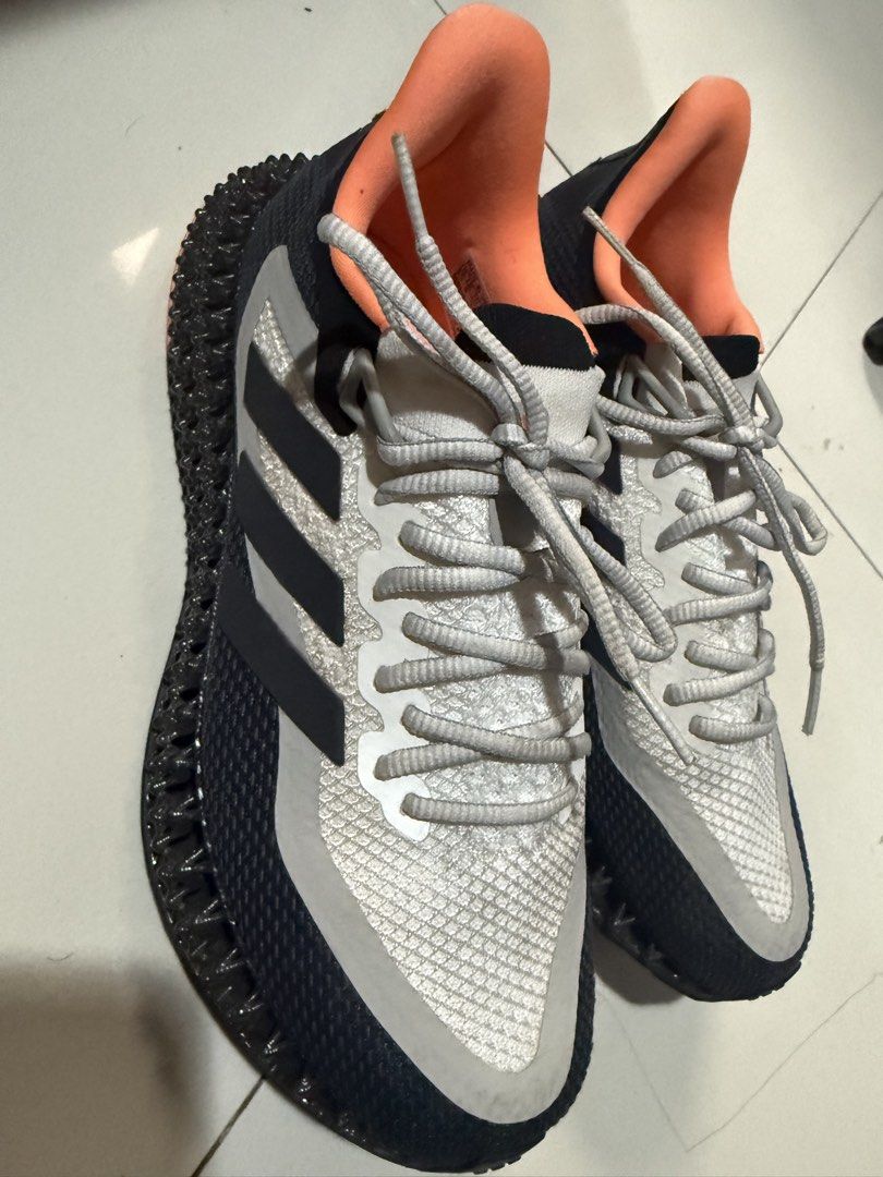 Adidas 4D Runner Sneakers (Category: Sneakers) located in Makati City. Submitted by robrobrob23 (Listing ID 1467362404, Image 2). Description: - Brand: Adidas - Model: 4D Running Shoes - Colorway: Black, White, and Orange - Size: US 6.5 - Midsole: Futuristic 4D printed lattice structure - Outsole: Continental rubber with orange traction pods for great grip - Upper: Breathable mesh with iconic 3-stripes - Origin: Made in Vietnam (Production Date: 
