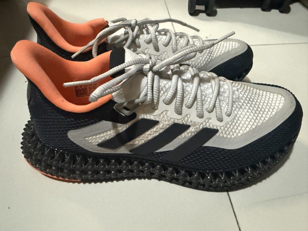 Adidas 4D Runner Sneakers (Category: Sneakers) located in Makati City. Submitted by robrobrob23 (Listing ID 1467362404, Image 1). Description: - Brand: Adidas - Model: 4D Running Shoes - Colorway: Black, White, and Orange - Size: US 6.5 - Midsole: Futuristic 4D printed lattice structure - Outsole: Continental rubber with orange traction pods for great grip - Upper: Breathable mesh with iconic 3-stripes - Origin: Made in Vietnam (Production Date: 