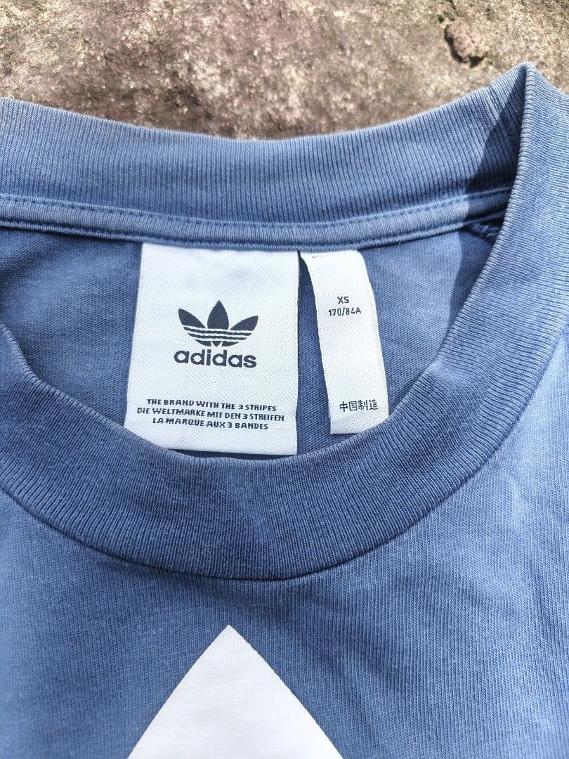 Adidas Blue Trefoil Tee Size XS (Category: Tshirts & Polo Shirts ) located in Manila. Submitted by gamierjohn28952 (Listing ID 1467215120, Image 2). Description: - Brand: Adidas - Color: Blue with large white trefoil logo - Size: XS (170/84A) - Material: 100% Cotton - Fit: Standard fit - Condition: Excellent / Great casual wear - Made in: China.