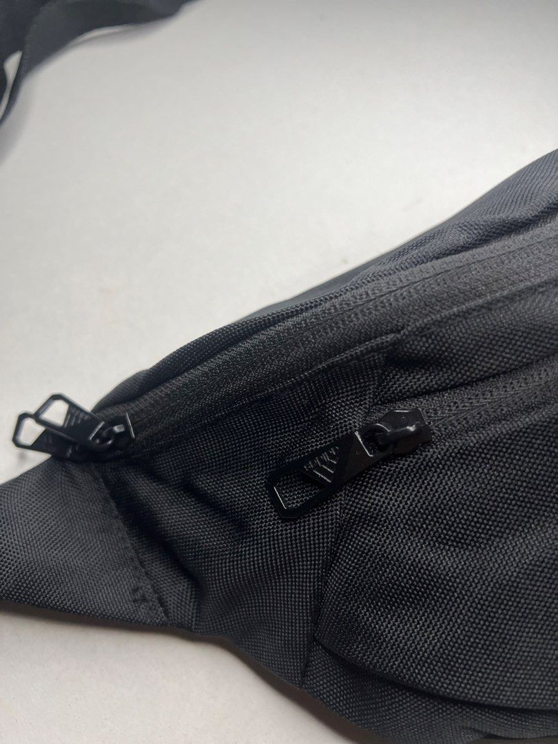 Adidas ESS Waist Bag Black (Category: Belt bags, Clutches and Pouches) located in Tacloban City. Submitted by thrftg (Listing ID 1467279772, Image 3). Description: - Authentic Adidas waist bag in classic black - Bold white Adidas logo patch on the front - Durable fabric built for everyday wear - Features a secure main compartment and handy front zip pocket - Adjustable strap with sturdy buckle closure - Ideal for daily errands, traveling, or gym 