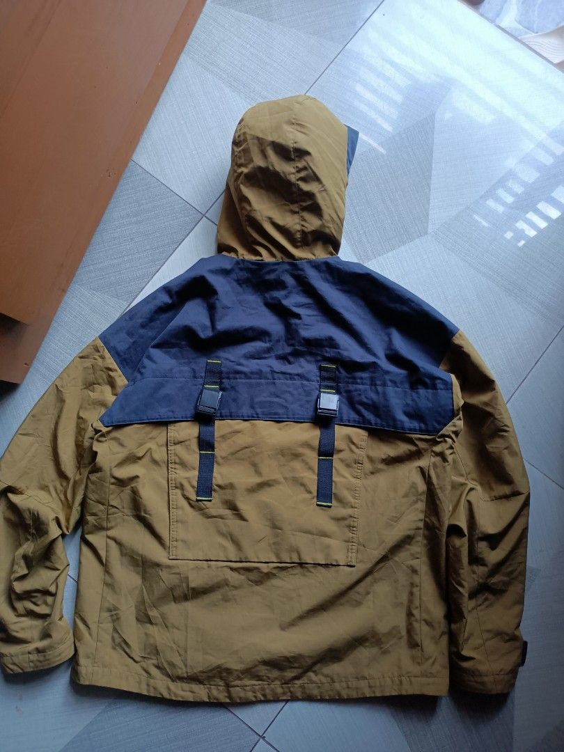 Adidas Hooded Jacket Brown Navy Blue Utility Pockets (Category: Coats, Jackets and Outerwear) located in Manila. Submitted by pnjdianne25879 (Listing ID 1467229609, Image 2). Description: large best fit w/ minimal issue hole overall solid condition - Brand: Adidas - Style: Outdoor jacket - Color: Brown and navy blue with yellow hood lining - Material: Durable ripstop fabric - Pockets: Front zip pocket and two large cargo pockets with buckle strap