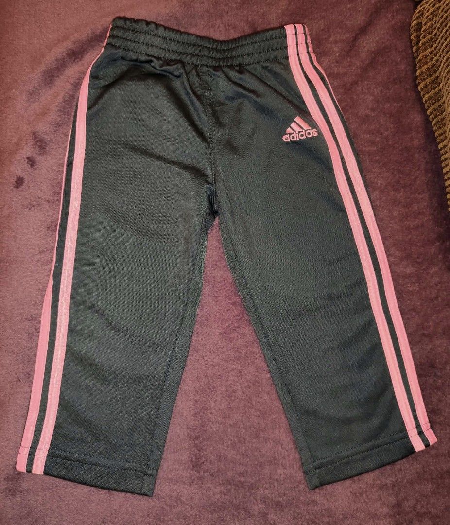Adidas kids Pants Size (Category: Babies & Kids Fashion) located in Manila. Submitted by jilliese (Listing ID 1467191520, Image 1). Description: - Brand: Adidas like new fit 2-3 - Color: Black with pink side stripes and logo - Material: Soft and lightweight polyester - Waistband: Elastic pull-on style - Condition: Clean hems, well-maintained - Style: Classic sporty look, perfect for daily wear or light workouts.