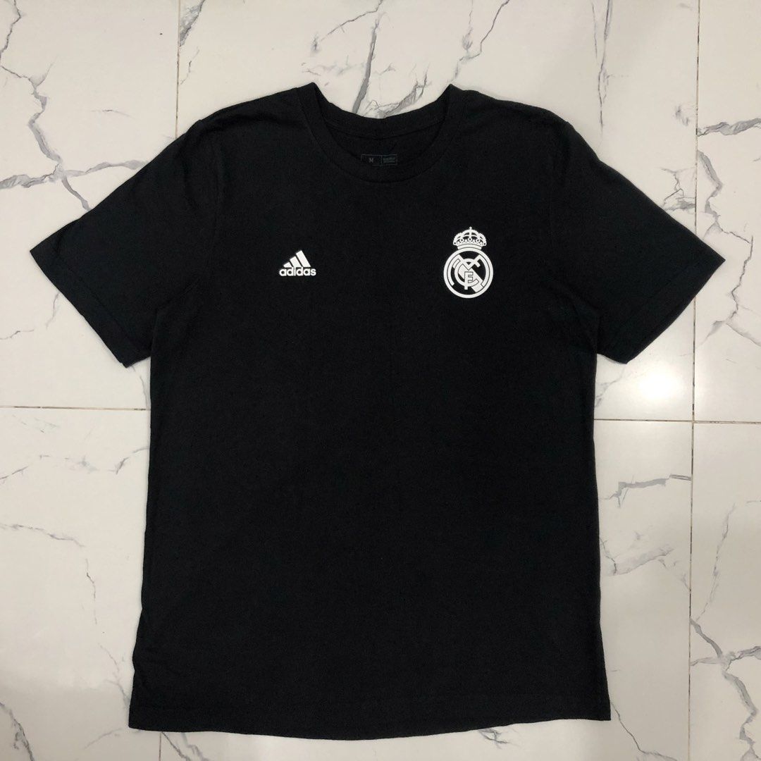 Adidas Real Madrid Black Tee Shirt (Category: Tshirts & Polo Shirts ) located in Manila. Submitted by fashionavenueph (Listing ID 1467240177, Image 1). Description: Size: Medium on Tag but can Fit to M-L Measurements: Width: 20.5 in Length: 29 in Condition: 10/10 Like New Color Rate: 10/10 (Color may vary due to the lighting) History: Bought from Adidas California Outlet (Retail) *Not Thrifted Bought Price: PHP 1600 RFS: Decluttering Issue: None 