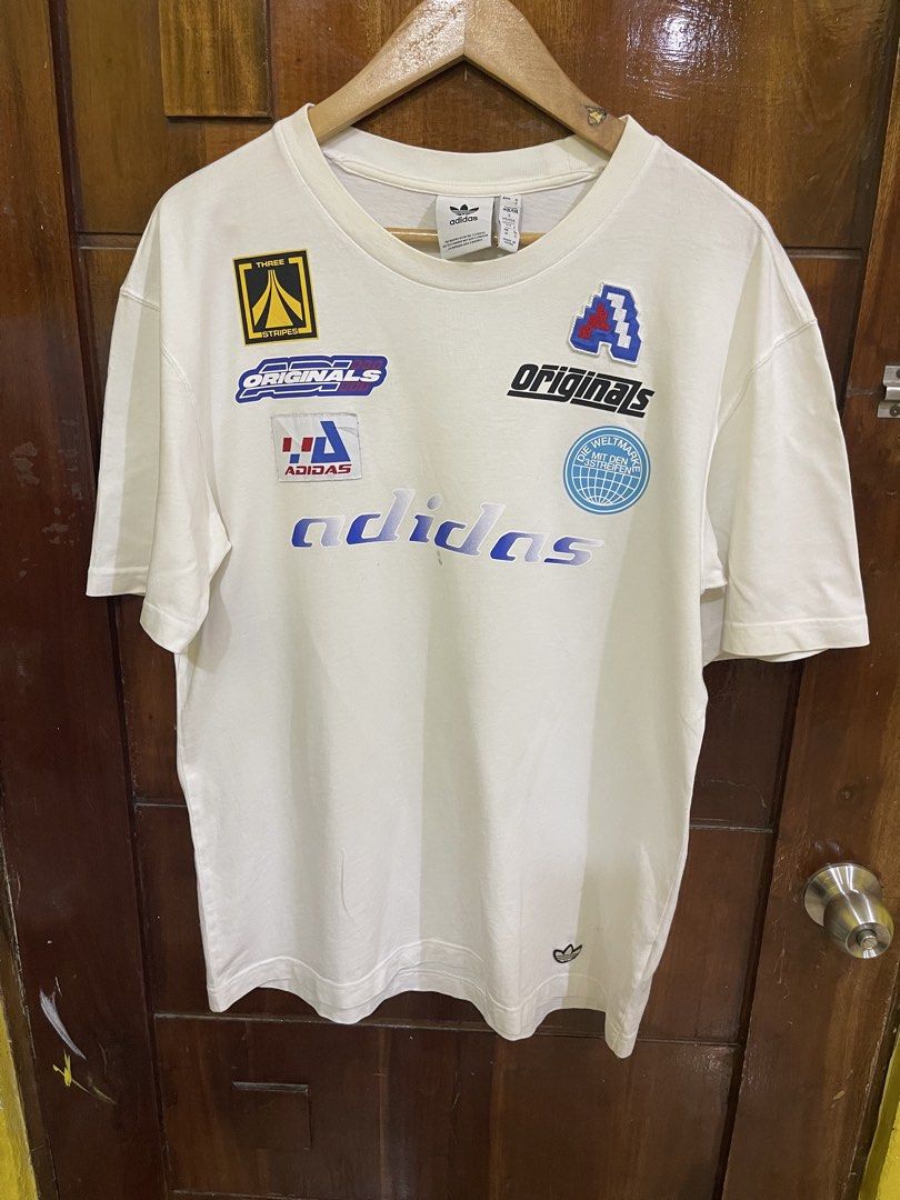 Adidas Shirt (Category: Tshirts & Polo Shirts ) located in Marikina City. Submitted by greatfindsmnlph (Listing ID 1467312028, Image 1). Description: Adi das Shirt Price: 150 Size: Medium Width: 21.5 Length: 29 Color: White Color Rate: 10/10 Condition: 9.5/10 with minor flaws Very nice in actual.