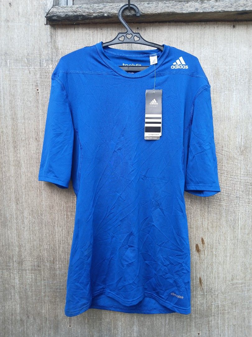 Adidas Techfit Compression Climalite Shirt Blue (Category: Activewear) located in Manila. Submitted by thrift_sixty (Listing ID 1467180271, Image 1). Description: - Brand: Adidas Techfit - Color: Bright Blue - Size: Medium (Standard Fit) - Condition: Brand new with original tags - Material: Climalite fabric for moisture management - Features: Short sleeves, crew neck, classic chest and back branding - Ideal for: Gym workouts, running, and athleti