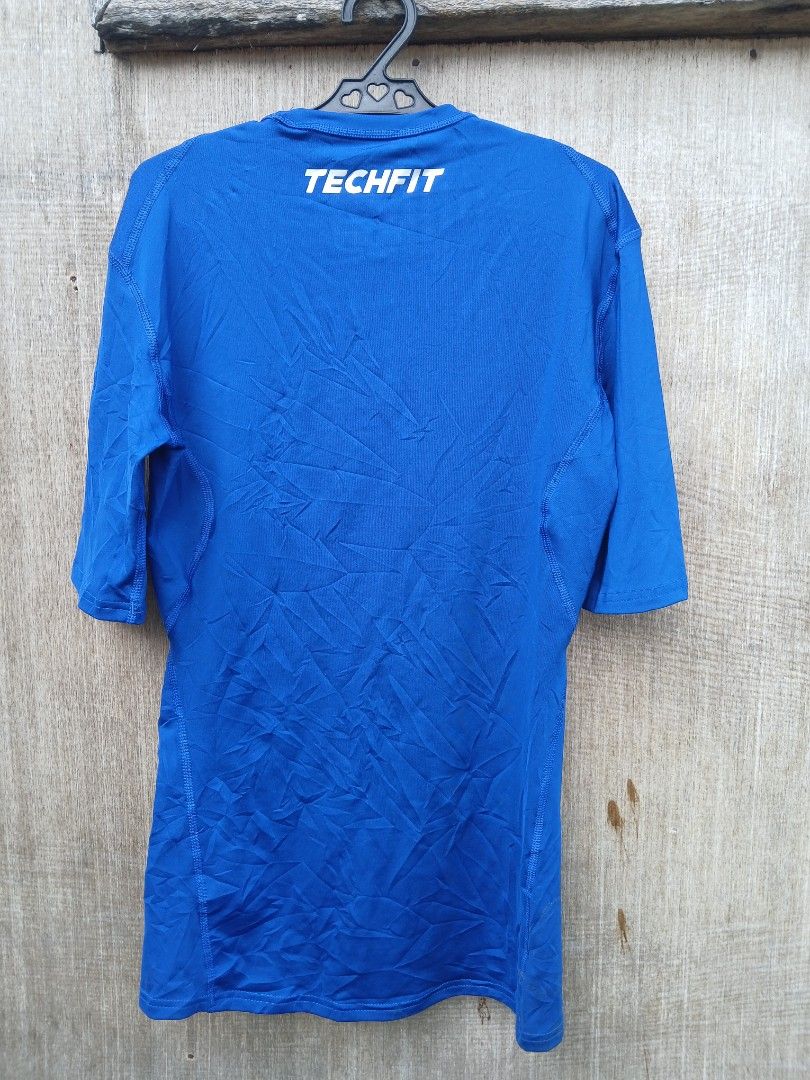 Adidas Techfit Compression Climalite Shirt Blue (Category: Activewear) located in Manila. Submitted by thrift_sixty (Listing ID 1467180271, Image 2). Description: - Brand: Adidas Techfit - Color: Bright Blue - Size: Medium (Standard Fit) - Condition: Brand new with original tags - Material: Climalite fabric for moisture management - Features: Short sleeves, crew neck, classic chest and back branding - Ideal for: Gym workouts, running, and athleti