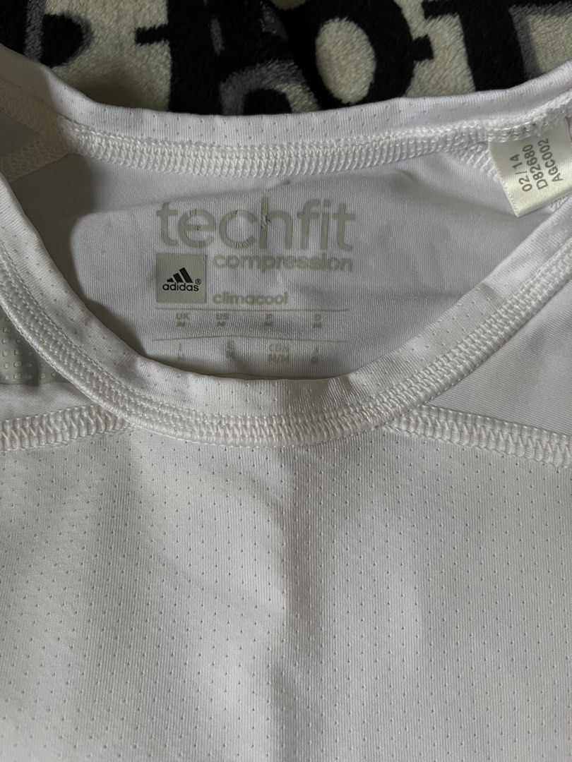 Adidas Techfit Compression Climacool Long Sleeve Shirt White (Category: Activewear) located in Silang. Submitted by kristan.asian (Listing ID 1467288517, Image 3). Description: - Brand: Adidas - Model: Techfit Compression Long Sleeve - Technology: Climacool for ultimate breathability and airflow - Color: White with grey accent panels on shoulders and sides - Size: Medium (UK, US, FR, D tags) - Material: Lightweight perforated fabric throughout th