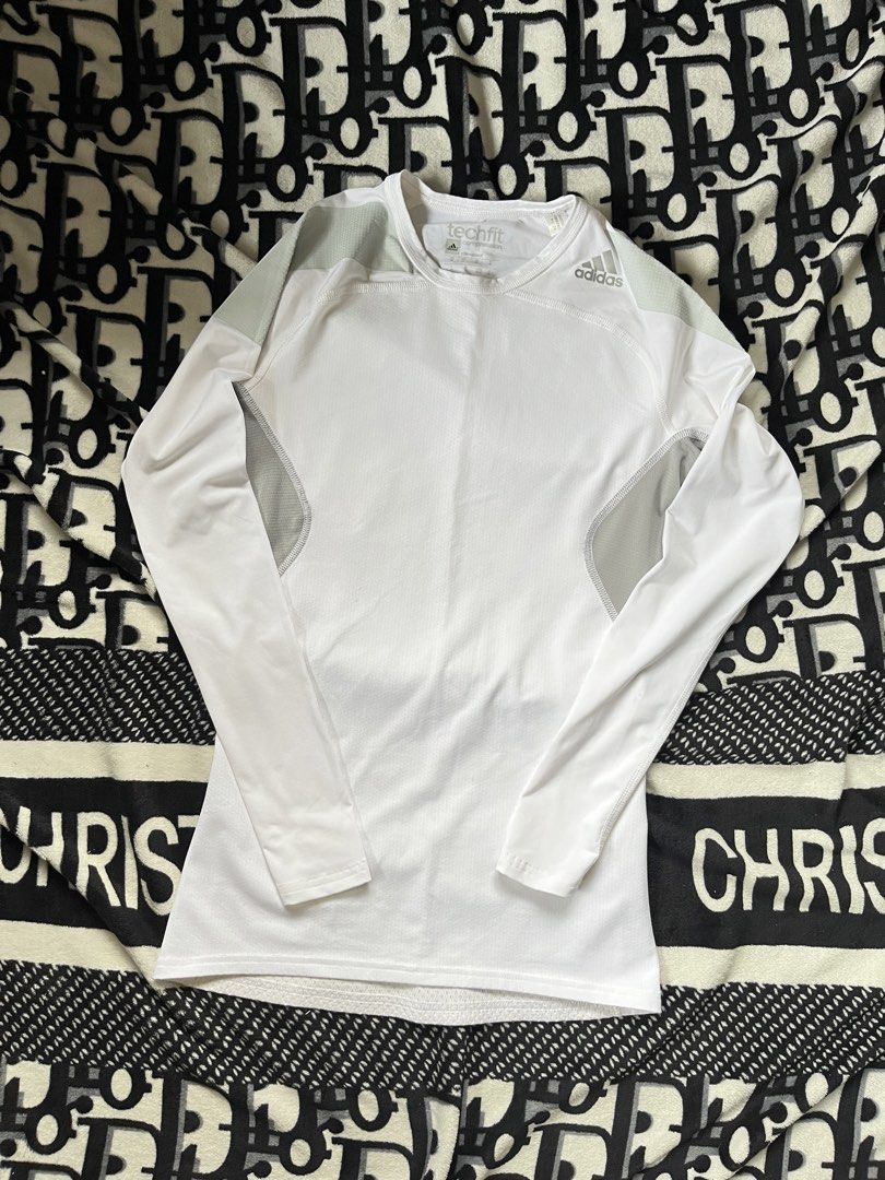 Adidas Techfit Compression Climacool Long Sleeve Shirt White (Category: Activewear) located in Silang. Submitted by kristan.asian (Listing ID 1467288517, Image 1). Description: - Brand: Adidas - Model: Techfit Compression Long Sleeve - Technology: Climacool for ultimate breathability and airflow - Color: White with grey accent panels on shoulders and sides - Size: Medium (UK, US, FR, D tags) - Material: Lightweight perforated fabric throughout th