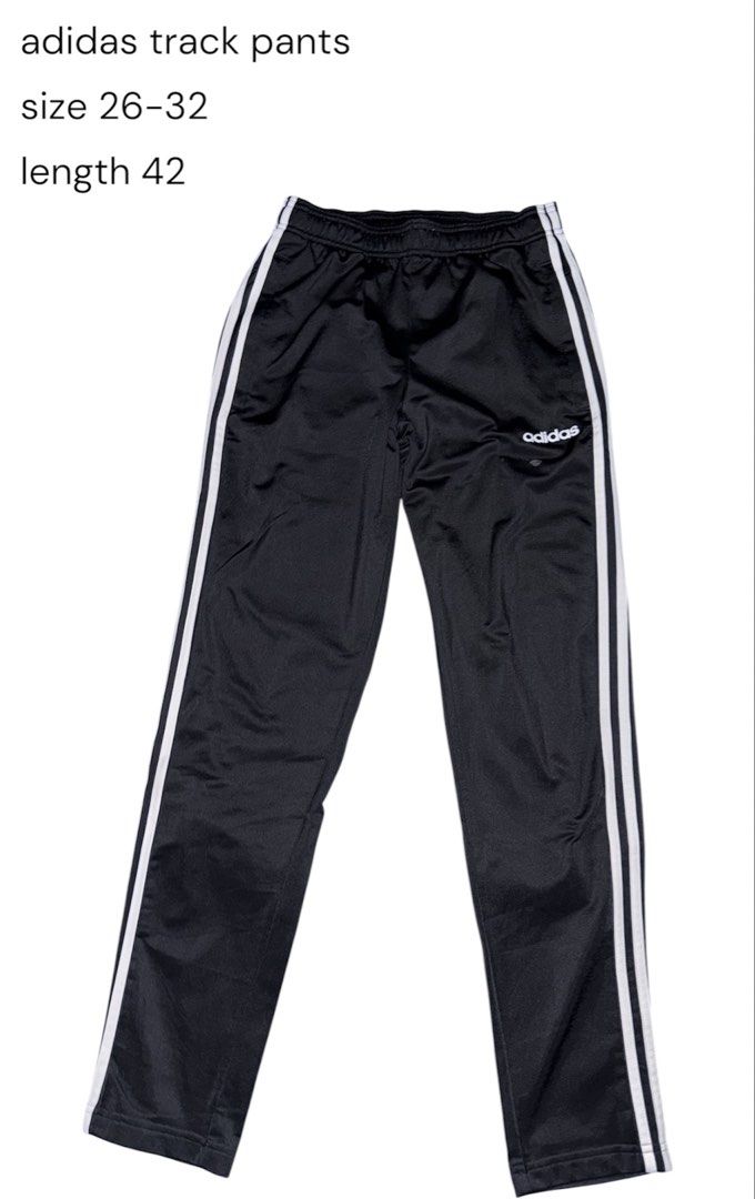 Adidas Track Pants Black White (Category: Joggers) located in San Narciso. Submitted by angels.attic21 (Listing ID 1467312208, Image 1). Description: - Brand: Adidas - Color: Black with classic white side stripes and embroidered logo - Size: Small on tag (fits waist 26 to 32 inches, length 42 inches) - Material: Lightweight and comfortable - Features: Elastic waistband with internal drawcord - Condition: Good overall, with a small, minor stain ne