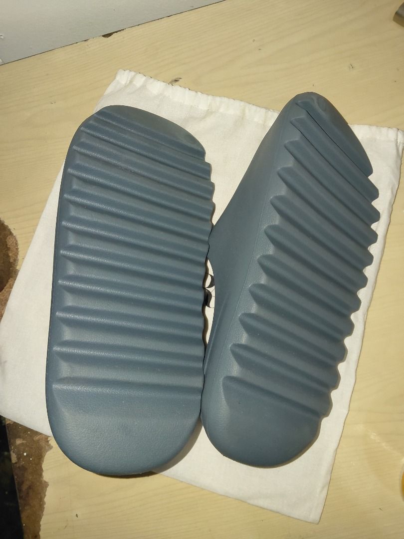 Adidas Yeezy Slides Slate Marine (Category: Slippers & Slides) located in Manila. Submitted by cosmicturtle.d1b615 (Listing ID 1464864394, Image 3). Description: - Model: Adidas Yeezy Slides - Colorway: Slate Marine - Design: Minimalist slip-on with a clean aesthetic - Comfort: Molded footbed for maximum, all-day cushioning - Traction: Chunky sawtooth sole for extra grip - Details: Iconic Adidas trefoil logo debossed on the heel bed - Usage: Vers