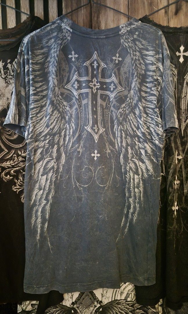 Affliction Demon Eyes GRAIL (Category: Tshirts & Polo Shirts ) located in Cebu City. Submitted by rurushuu (Listing ID 1467206283, Image 2). Description: 21x28 Size small 3 pinholes 7500 (reason is becayuse i bought it intl.) free shipping nationwide slight nego.