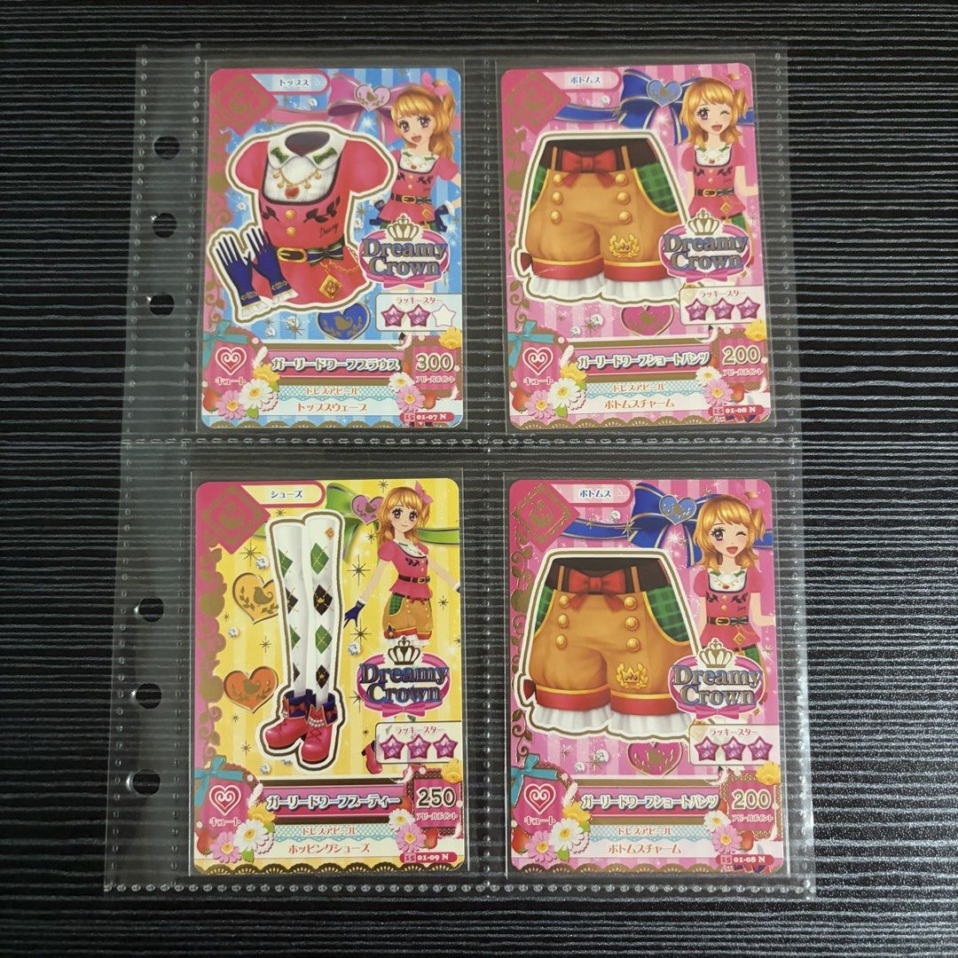 Aikatsu! Girly Dwarf Coord Cards 4pc (Category: Raw Singles) located in Manila. Submitted by ayumitsukishiro (Listing ID 1467209250, Image 1). Description: Purchased from Japan! This is Aikatsu’s Dreamy Crown’s Girly Dwarf Coord. It’s a full coord set with an extra Girly Dwarf Short Pants card! Bulk sales are also accepted! The cards are sleeved. Binder page not included..