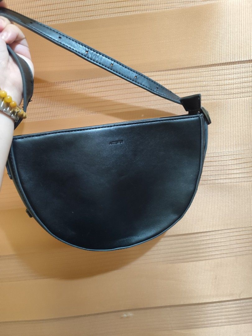 Aittfsy Black Half Moon Crossbody Bag (Category: Cross-body Bags) located in Naga. Submitted by semflewer (Listing ID 1467345081, Image 2). Description: - Style: Minimalist half-moon shoulder bag - Material: Smooth, premium faux leather with clean black lining - Strap: Adjustable for a custom fit - Storage: Secure main compartment with an interior zippered pocket - Closure: Top zipper to keep your daily essentials safe - Perfect for: Casual daily