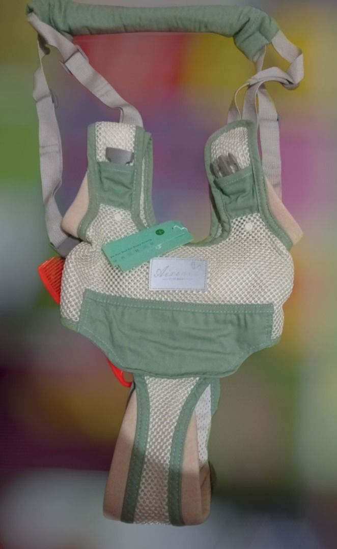 Aixeniu Multipurpose harness and carrier (Category: Carriers & Slings) located in Las Pinas. Submitted by mico090493 (Listing ID 1467361660, Image 1). Description: - Suitable for ages 9 to 24 months (Max load: 15kg) - Made from 100% cotton with breathable polyester mesh - Stylish green and beige color combination - Adjustable shoulder straps and top handle for easy guidance.