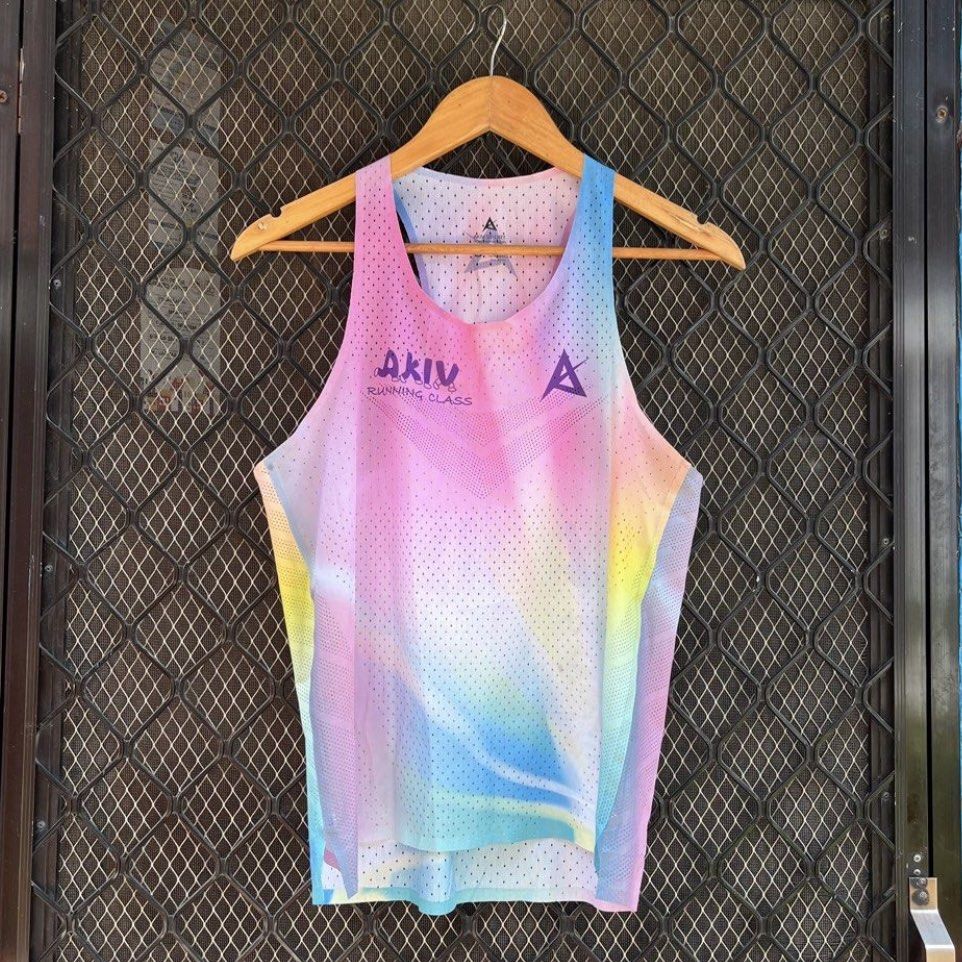 AKIV Elite Running Class Racing Singlet Size S (Category: Activewear) located in Cagayan de Oro. Submitted by rhujimcbroken (Listing ID 1467269121, Image 1). Description: - Brand: AKIV Elite Running Class - Edition: Limited edition design with vibrant pastel tie-dye gradient - Size: Unisex Size S - Material: Dot perforation mesh fabric for maximum breathability - Details: Purple AKIV graphics on chest and back - Condition: Lightweight, clean, and