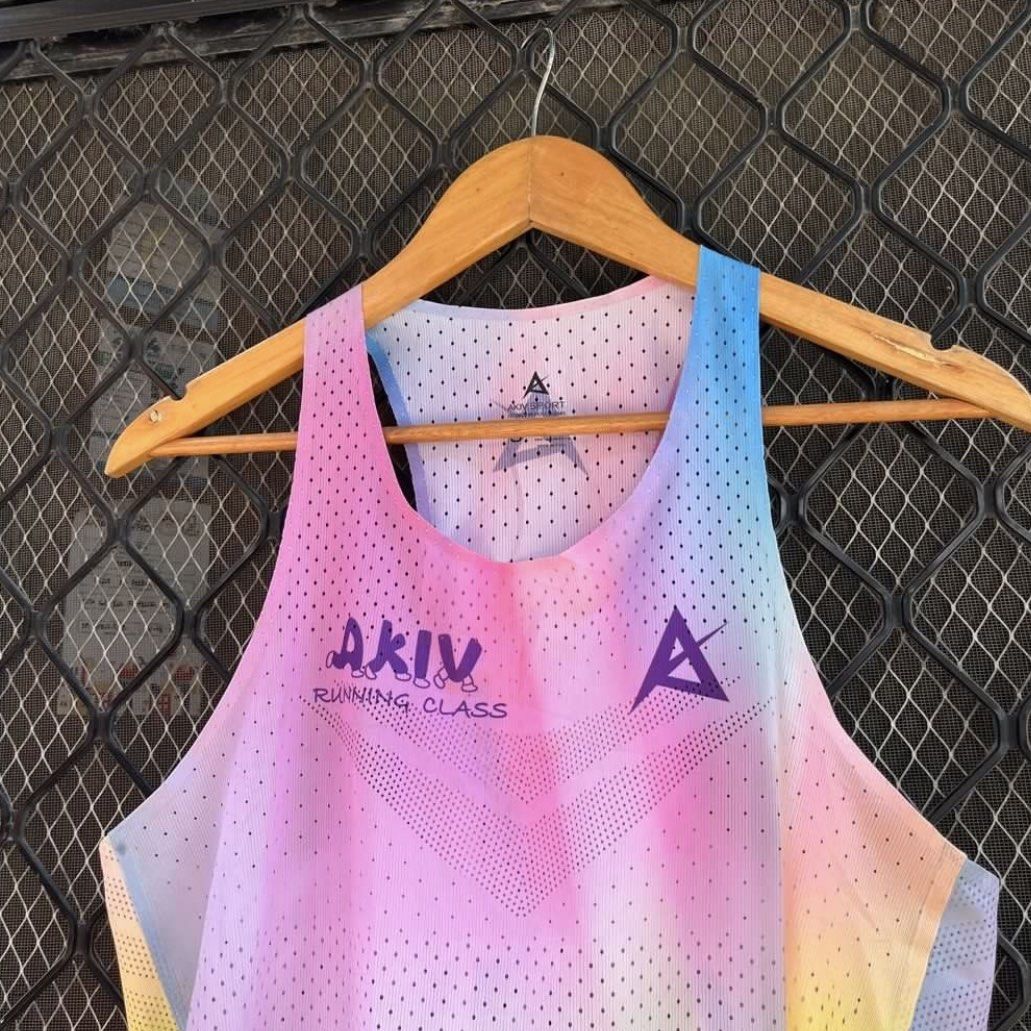 AKIV Elite Running Class Racing Singlet Size S (Category: Activewear) located in Cagayan de Oro. Submitted by rhujimcbroken (Listing ID 1467269121, Image 2). Description: - Brand: AKIV Elite Running Class - Edition: Limited edition design with vibrant pastel tie-dye gradient - Size: Unisex Size S - Material: Dot perforation mesh fabric for maximum breathability - Details: Purple AKIV graphics on chest and back - Condition: Lightweight, clean, and