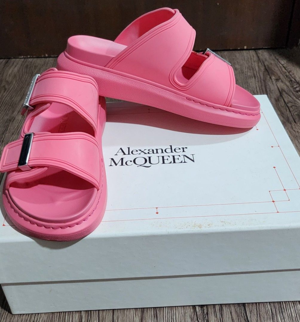 Alexander McQueen Pink Rubber Slide Sandals (Category: Slippers and slides) located in Taytay. Submitted by luxebagcray (Listing ID 1467341087, Image 2). Description: - Brand: Alexander McQueen - Color: Bright Pink - Style: Double strap rubber slide sandals with silver-tone buckles - Features: Chunky platform sole, molded footbed, debossed brand name on side and tread - Inclusions: Original box and dust bag included - Condition: Excellent, ready 