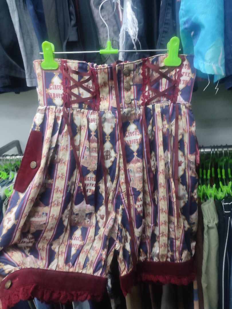 Alice and the Pirates Regimental Carousel Pants (Category: Jeans) located in Baguio. Submitted by perrycore_27 (Listing ID 1467200360, Image 3). Description: - Brand: Alice and the Pirates - Item: Regimental Carousel Shorts - Color/Pattern: Blue, red, and cream stripes with circus and carousel print - Design: High waist with decorative front buttons, burgundy ribbon lacing on sides and back, and velvet cuffs with scalloped lace trim - Style: Stat