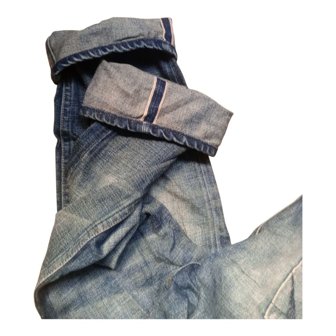 AllSaints Spit Alfields Denim Jeans Size 32 (Category: Jeans) located in Caloocan City. Submitted by goldendragon_b05555 (Listing ID 1467361953, Image 3). Description: - Brand: AllSaints (Spit Spitalfields) - Size: 32 - Fit: Straight leg - Wash: Classic blue with natural fading on thighs and seat - Details: Distressed styling, button fly, and cuffed hems with visible selvedge ID - Branding: Black leather back patch and interior branded fabric lab