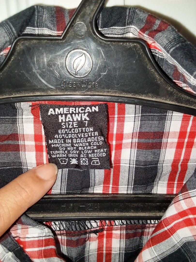 American Hawk Red Black Plaid Long Sleeve Button Down Shirt (Category: Babies & Kids Fashion) located in Trece Martires City. Submitted by lotlotonlineshop (Listing ID 1467336533, Image 2). Description: - Brand: American Hawk - Style: Long sleeve button-down shirt with standard collar - Pattern: Classic red, black, and white plaid - Details: Single chest pocket with small brown logo patch, button cuffs - Material: 60% cotton, 40% polyester (machi