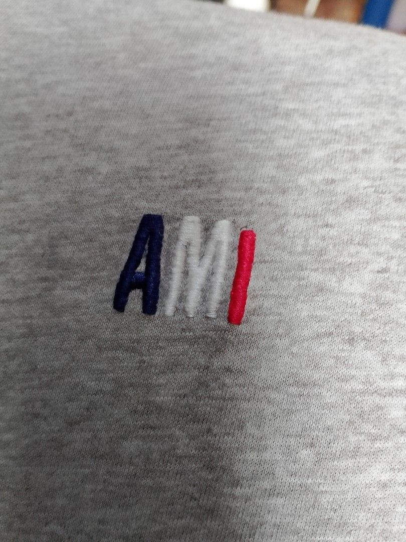Ami Paris T-Shirt Grey Size S (Category: Tshirts & Polo Shirts ) located in San Pedro. Submitted by jokwanrocks09 (Listing ID 1467255145, Image 3). Description: Grey cotton t-shirt from Ami Alexandre Mattiussi. Small tricolor Ami embroidery on the chest. Matching tonal Ami embroidery under the back neckline. Crew neck and short sleeves. Regular fit, size S. Tag attached inside the collar. 19x26 small .
