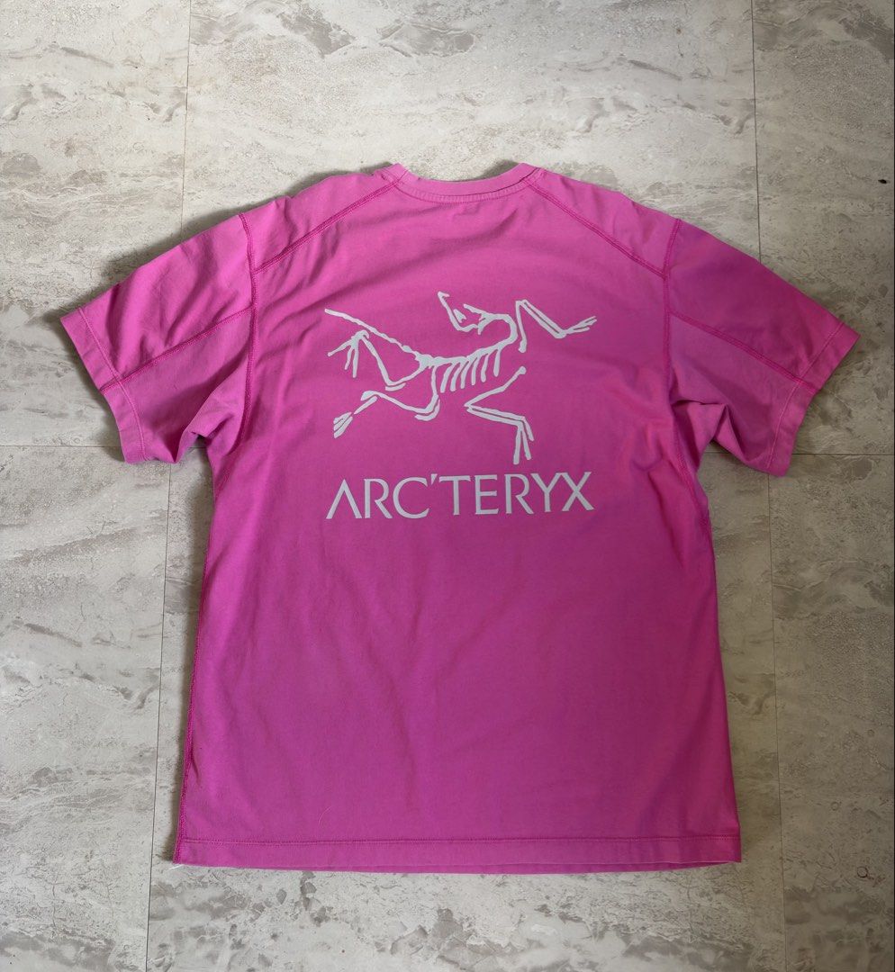 Arc'teryx Bird Tee Pink Size S (Category: Tshirts & Polo Shirts ) located in Manila. Submitted by brighthorse.b8f582 (Listing ID 1467273290, Image 2). Description: - Brand: Arc'teryx - Item: T-shirt with iconic bird skeleton graphic - Color: Bright pink / washed tone - Size: Men's Small - Details: Large back graphic, small chest logo, crew neck, short sleeves - Origin: Made in Latvia - Material: Cotton blend - Condition: Clean piece with minor we
