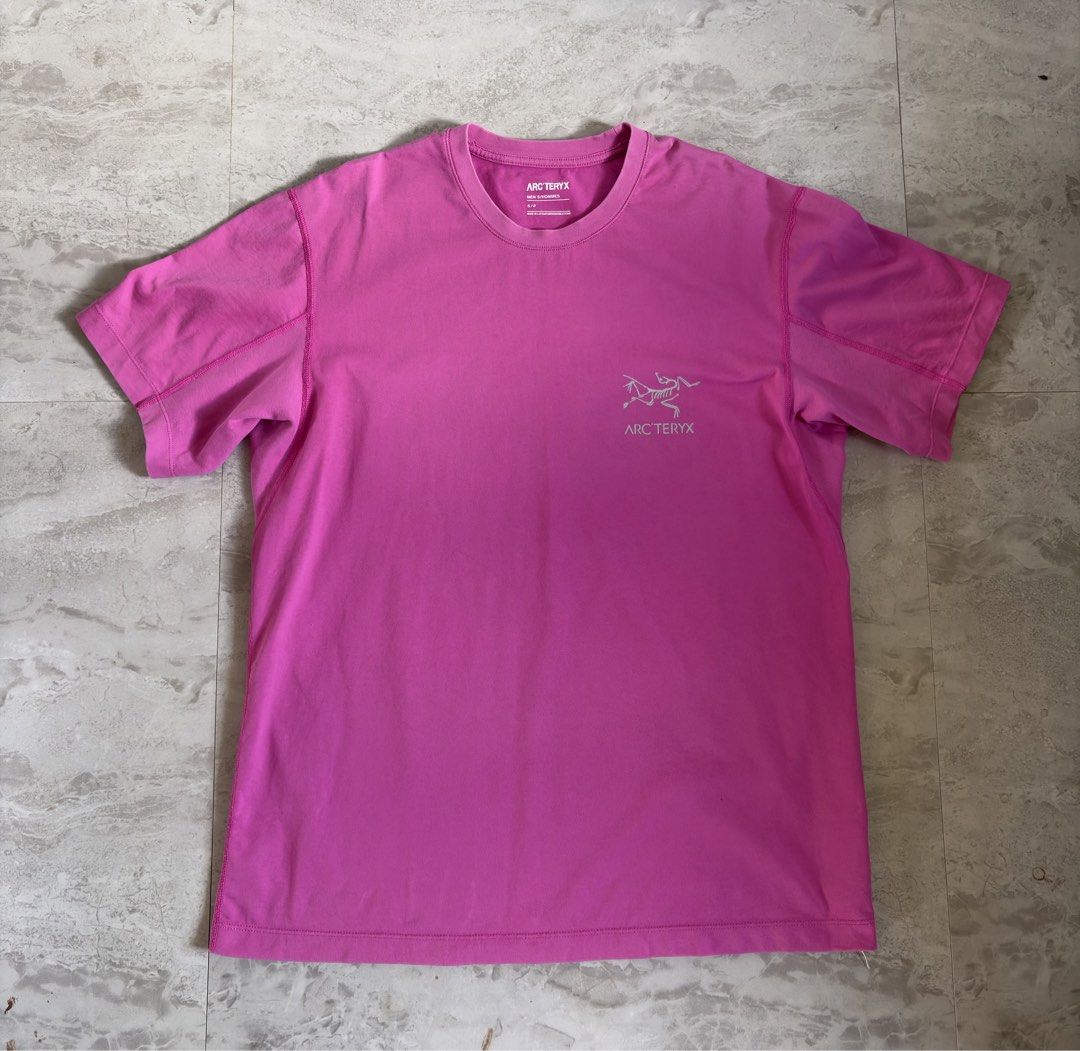Arc'teryx Copal Bird Tee Pink Men's Size S (Category: Tshirts & Polo Shirts ) located in Banga. Submitted by jorguarino (Listing ID 1467178202, Image 1). Description: Arc'teryx Copal Bird Tee in a vibrant pink colorway. Classic fossil bird logo printed on the back and chest. Men's size small. Made in Latvia from comfortable cotton blend fabric. Short sleeve crewneck cut. Great piece for outdoor activities or casual streetwear looks. Clean graphic