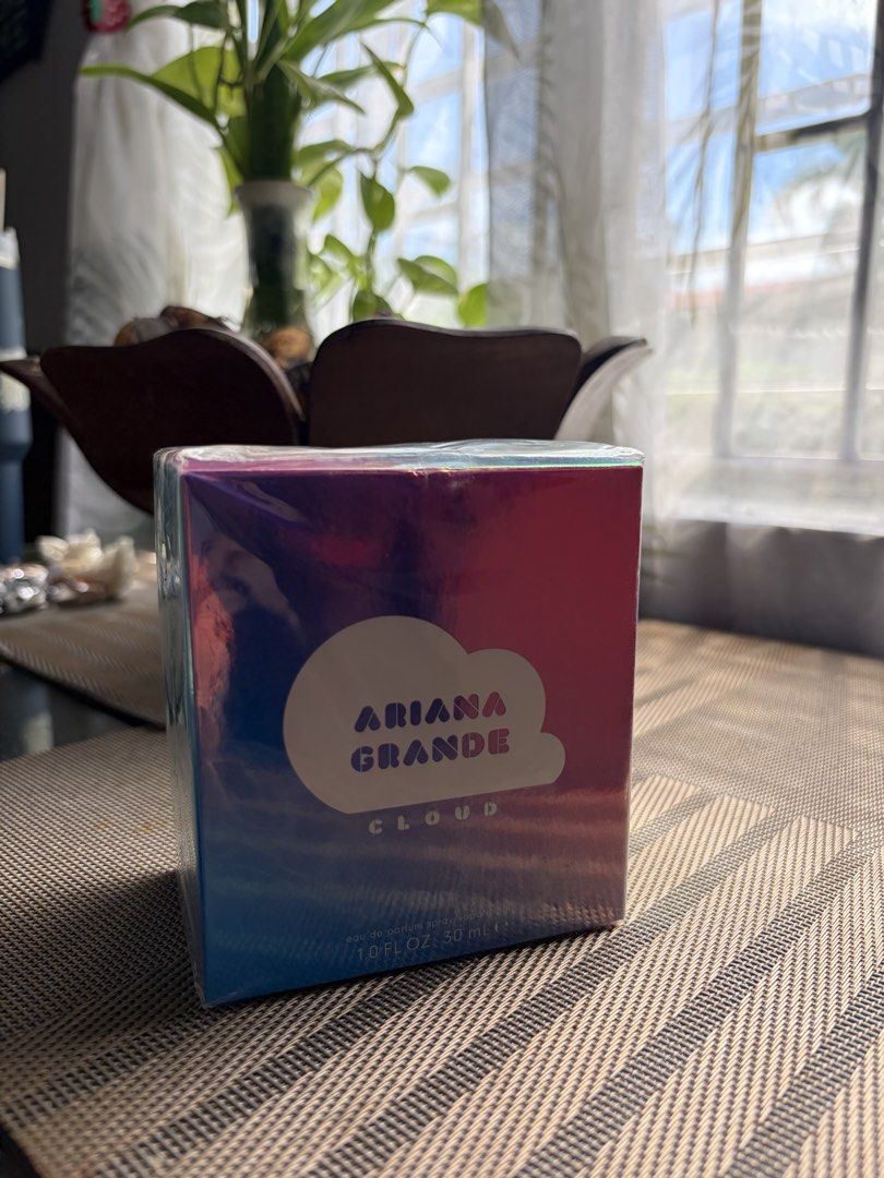 Ariana Grande Cloud Eau de Parfum 30ml (Category: Fragrance & Deodorants) located in Manila. Submitted by rjijgg (Listing ID 1467290394, Image 1). Description: - Brand: Ariana Grande Cloud Eau de Parfum - Size: 30 ml / 1.0 fl oz - Condition: Brand new, 100% authentic, and still sealed in original plastic packaging - Packaging: Holographic purple and blue box featuring the iconic cloud design - Scent Profile: Sweet, dreamy, and long-lasting fragra