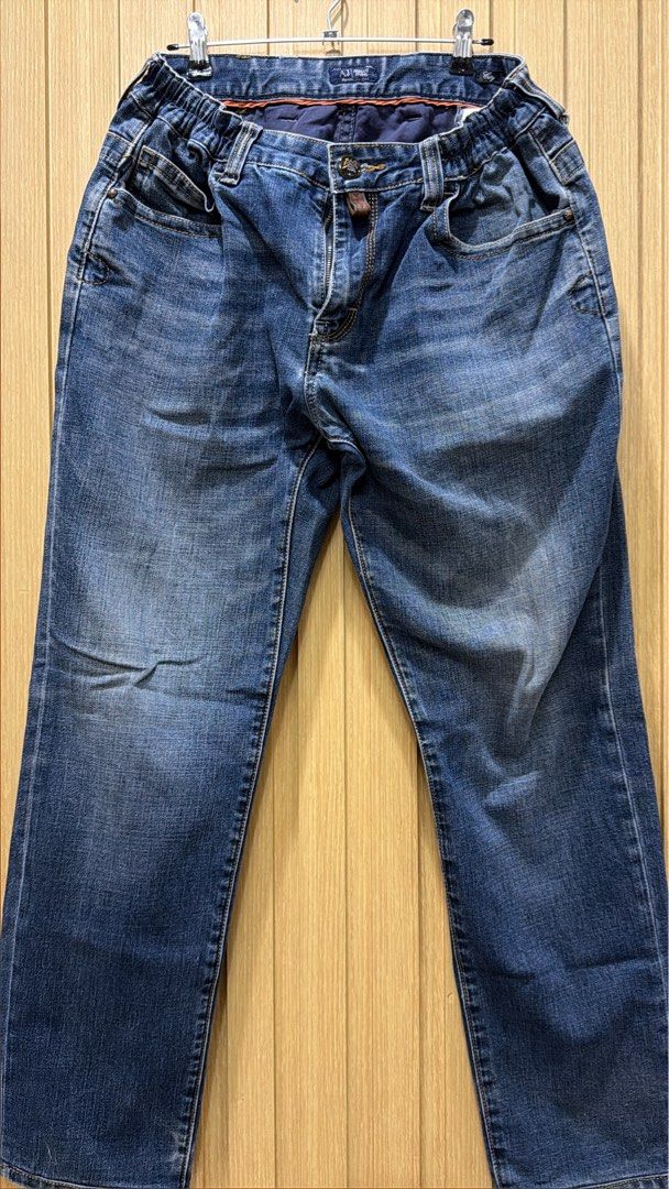 Armani Jeans Denim Jeans Size 32 / 33 (Category: Jeans) located in Bacoor. Submitted by preloved_with_love_ (Listing ID 1467255402, Image 1). Description: - Brand: Armani Jeans - Color/Wash: Dark blue wash - Waist: Elastic waistband for all-day comfort - Closure: Branded button and custom front zipper pull - Pockets: Classic five-pocket setup with stitched back pockets - Details: Genuine leather brand patch at the back waistline - Condition: Grea