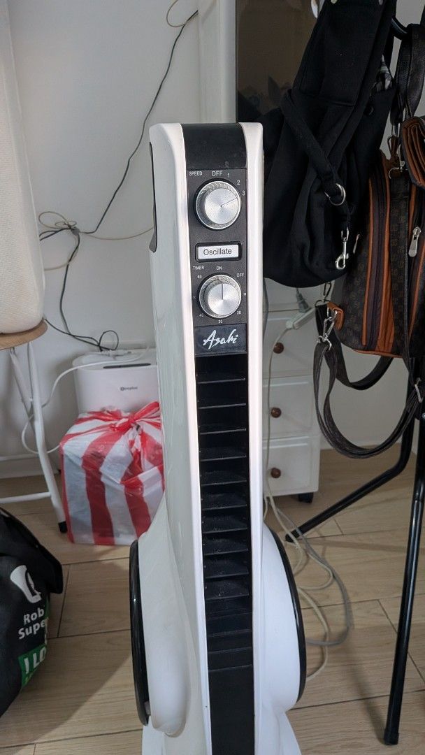 Asahi Tower Fan with Oscillation and Timer (Category: Fans) located in Makati City. Submitted by litolcloset (Listing ID 1467304921, Image 1). Description: Issue: need lang higpitan screw sa ilalim para maka swing. Other than that, no issue na. nego.