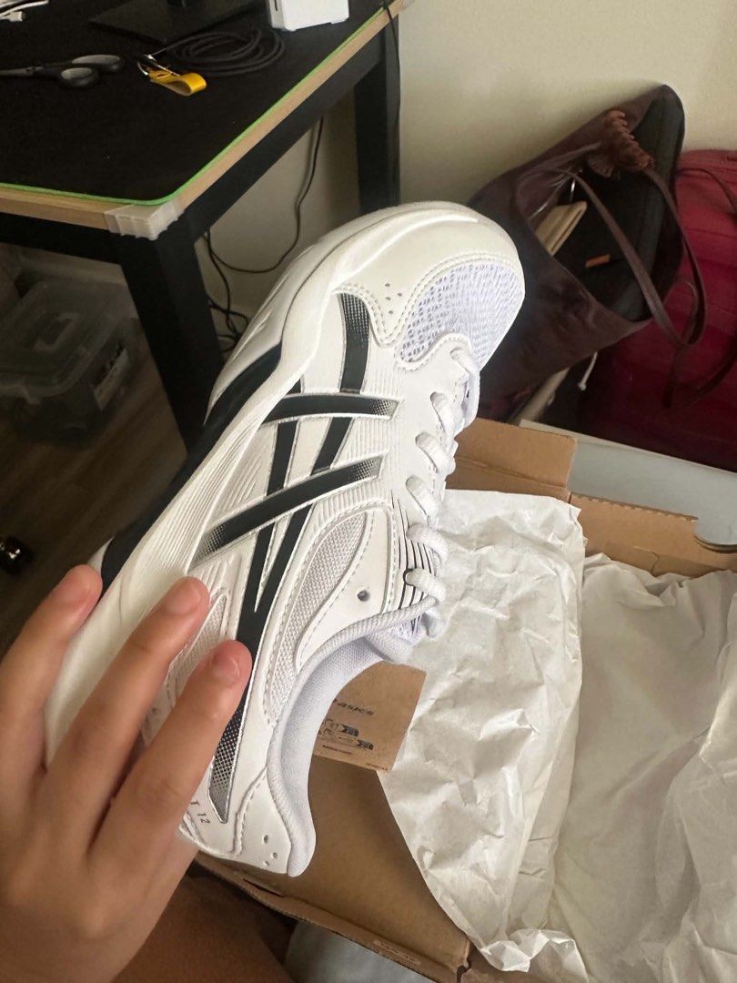 ASICS Gel Rocket 12 with box (Category: Sneakers) located in Manila. Submitted by possiblymaybe.717 (Listing ID 1467328060, Image 2). Description: - Brand: Asics - Color: White and black - Condition: Brand new, unworn with tags attached - Features: Breathable mesh upper with bold side stripes, original shoelaces, and branded tongue label - Inclusions: Comes with original Asics shoebox - Clean soles, fresh out of the box.