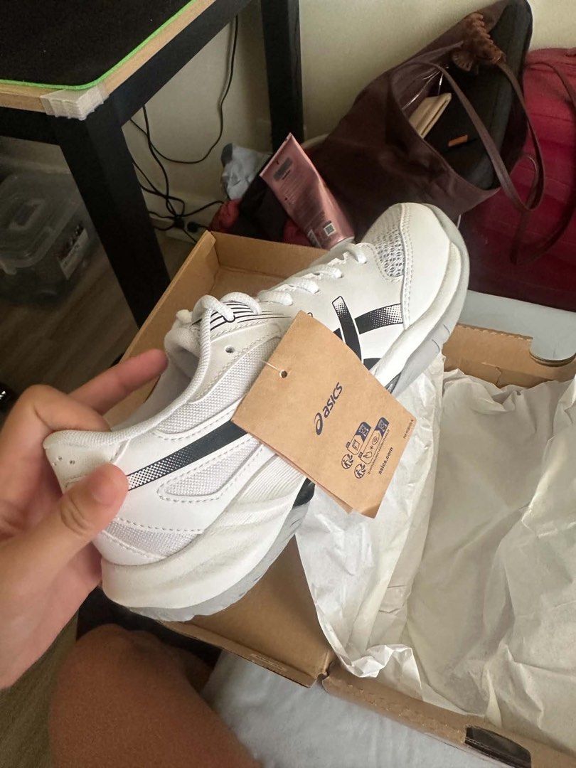 ASICS Gel Rocket 12 with box (Category: Sneakers) located in Manila. Submitted by possiblymaybe.717 (Listing ID 1467328060, Image 1). Description: - Brand: Asics - Color: White and black - Condition: Brand new, unworn with tags attached - Features: Breathable mesh upper with bold side stripes, original shoelaces, and branded tongue label - Inclusions: Comes with original Asics shoebox - Clean soles, fresh out of the box.