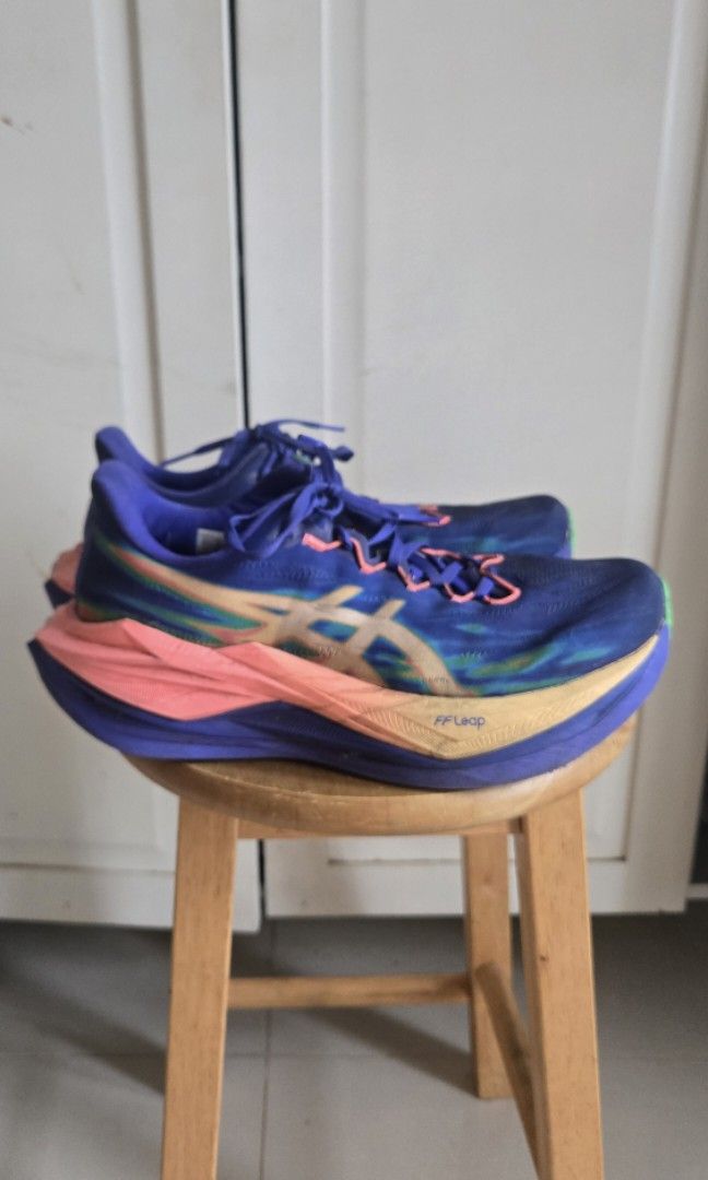 ASICS Super Blast 3 (Category: Sneakers) located in Mandaluyong City. Submitted by ohayouclub (Listing ID 1466993862, Image 1). Description: - Brand: ASICS - Colorway: Deep blue upper with multi-color gradient branding (blue, pink, orange) - Tech: FF Blast+ and FF Leap technology visible on sole and midsole - Condition: Moderate wear on soles, with dirt and scuffing on the green rubber outsole inserts from previous runs - great condition - great 
