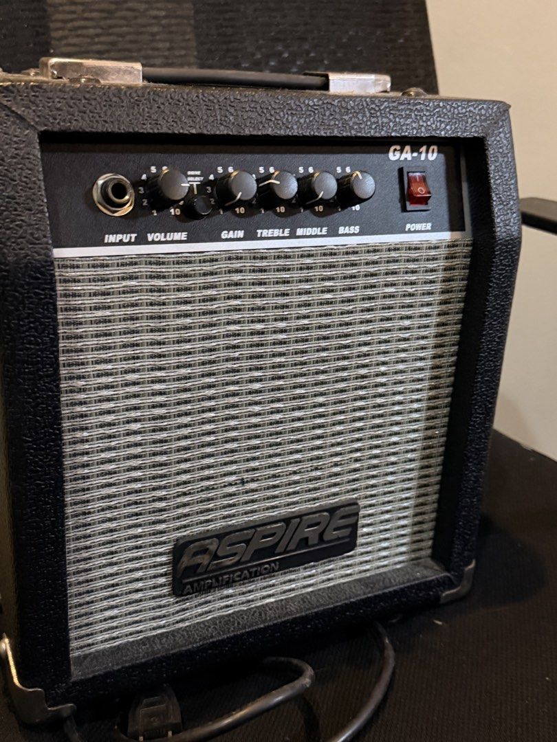 Aspire GA-10 Guitar Amplifier (Category: Musical Instruments) located in Manila. Submitted by truestar-9eec (Listing ID 1467327776, Image 2). Description: - Brand/Model: Aspire GA-10 Practice Guitar Amp - Condition: Clean, 100% working, great for home use - Controls: Volume, Gain, Treble, Middle, Bass, and Drive Select switch - Inputs & Outputs: Standard input jack and headphone output - Power: Built-in power cable (220-240V) - Design: Compact si