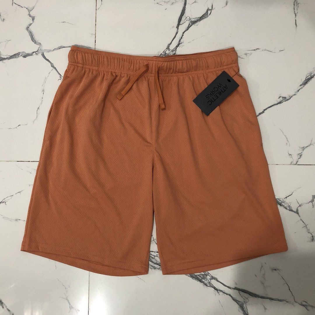 Athletic Works Orange Mesh Athletic Shorts (Category: Shorts) located in Manila. Submitted by fashionavenueph (Listing ID 1467288696, Image 1). Description: Size: Medium on Tag but can fit to (Small and up) Measurements: Width: 16 in Waistline: 30 to 34 in (Expandable/Adjustable) Length: 20 in Condition: 10/10 Brand New with Tags Color Rate: 10/10 (Color may vary due to the lighting) History: Bought from Sports Outlet in California (Retail) *Not 
