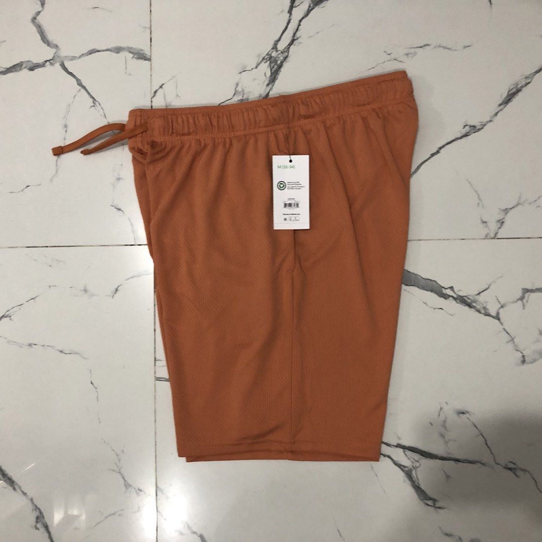 Athletic Works Orange Mesh Athletic Shorts (Category: Shorts) located in Manila. Submitted by fashionavenueph (Listing ID 1467288696, Image 2). Description: Size: Medium on Tag but can fit to (Small and up) Measurements: Width: 16 in Waistline: 30 to 34 in (Expandable/Adjustable) Length: 20 in Condition: 10/10 Brand New with Tags Color Rate: 10/10 (Color may vary due to the lighting) History: Bought from Sports Outlet in California (Retail) *Not 