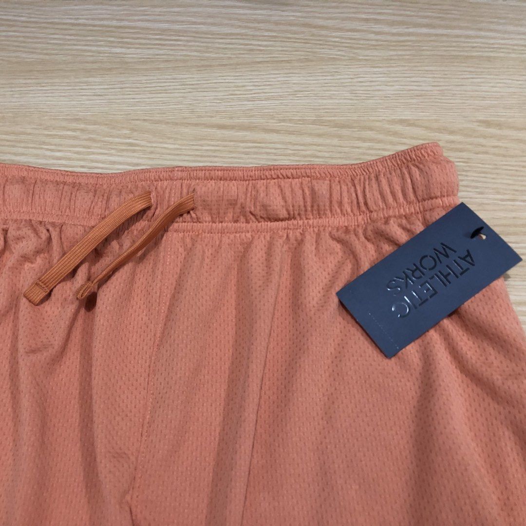 Athletic Works Orange Mesh Athletic Shorts (Category: Shorts) located in Manila. Submitted by fashionavenueph (Listing ID 1467288696, Image 3). Description: Size: Medium on Tag but can fit to (Small and up) Measurements: Width: 16 in Waistline: 30 to 34 in (Expandable/Adjustable) Length: 20 in Condition: 10/10 Brand New with Tags Color Rate: 10/10 (Color may vary due to the lighting) History: Bought from Sports Outlet in California (Retail) *Not 