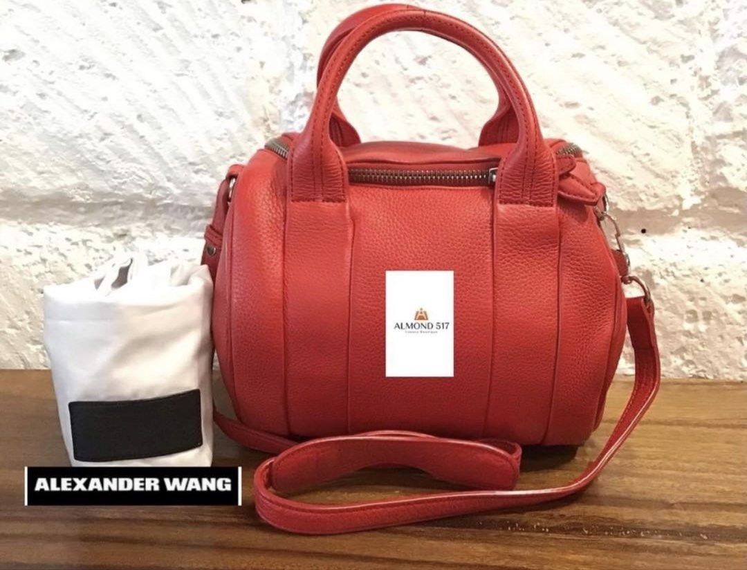 AUTHENTIC ALEXANDER WANG 2-WAY ROCKIE BAG (Category: Luxury Bags & Wallets) located in Pasig City. Submitted by the_queen_bee (Listing ID 1467260882, Image 1). Description: Bought for 15K+ in ALMOND 517 LUXURY store in Serendra last June 2025 Clean, no issue. With dustbag Pebbled lambskin Alexander Wang “Rockie” bag with duffle silhouette. Short leather top handles, with an optional shoulder strap, and silver studded base and hardware. Grey fabri