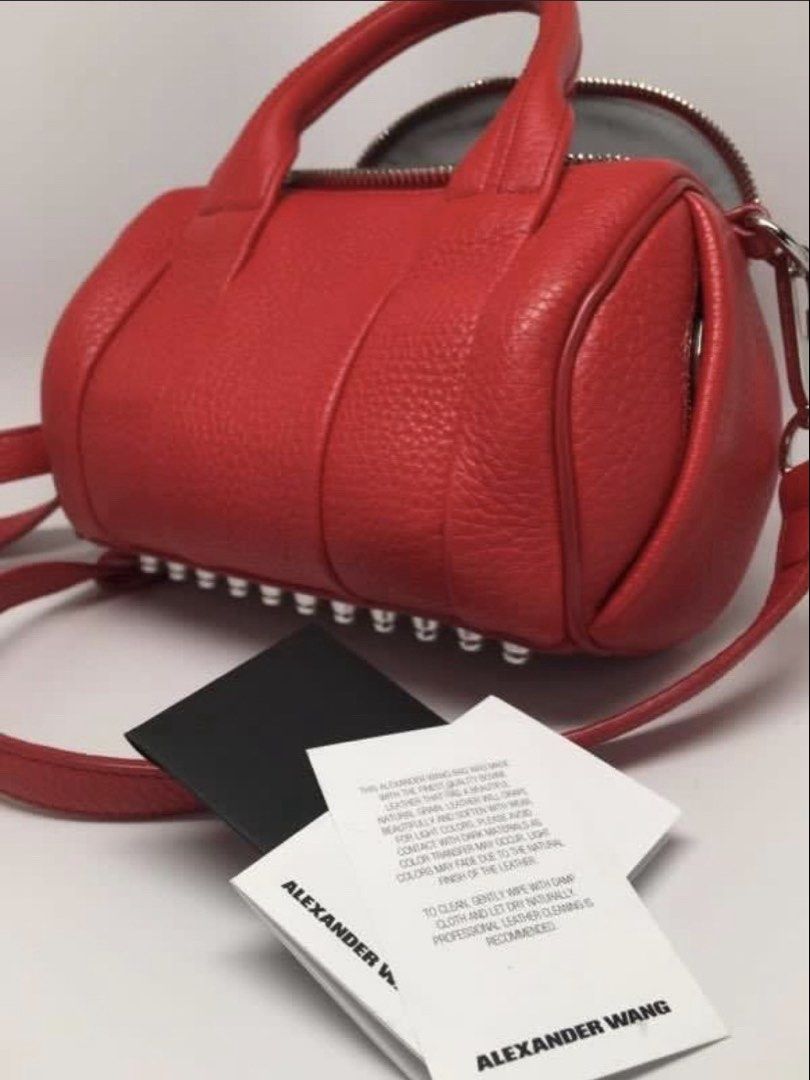 AUTHENTIC ALEXANDER WANG 2-WAY ROCKIE BAG (Category: Luxury Bags & Wallets) located in Pasig City. Submitted by the_queen_bee (Listing ID 1467260882, Image 3). Description: Bought for 15K+ in ALMOND 517 LUXURY store in Serendra last June 2025 Clean, no issue. With dustbag Pebbled lambskin Alexander Wang “Rockie” bag with duffle silhouette. Short leather top handles, with an optional shoulder strap, and silver studded base and hardware. Grey fabri