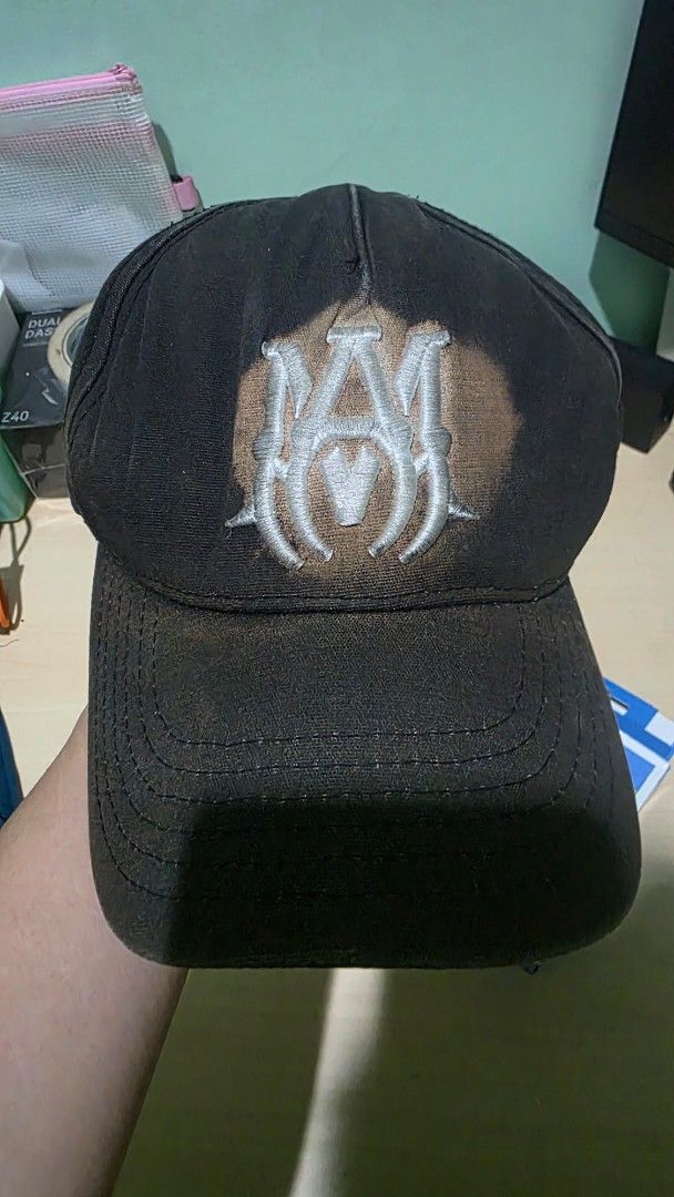 Authentic Amiri Baseball Cap - Washed out (Category: Caps & Hats) located in Paranaque City. Submitted by re_i_gn (Listing ID 1467183357, Image 1). Description: Original Amiri baseball cap from Japan - Embroidered logo - Washed out (discolored) parts on logo and rim - Well-worn but good condition - Needs cleaning.