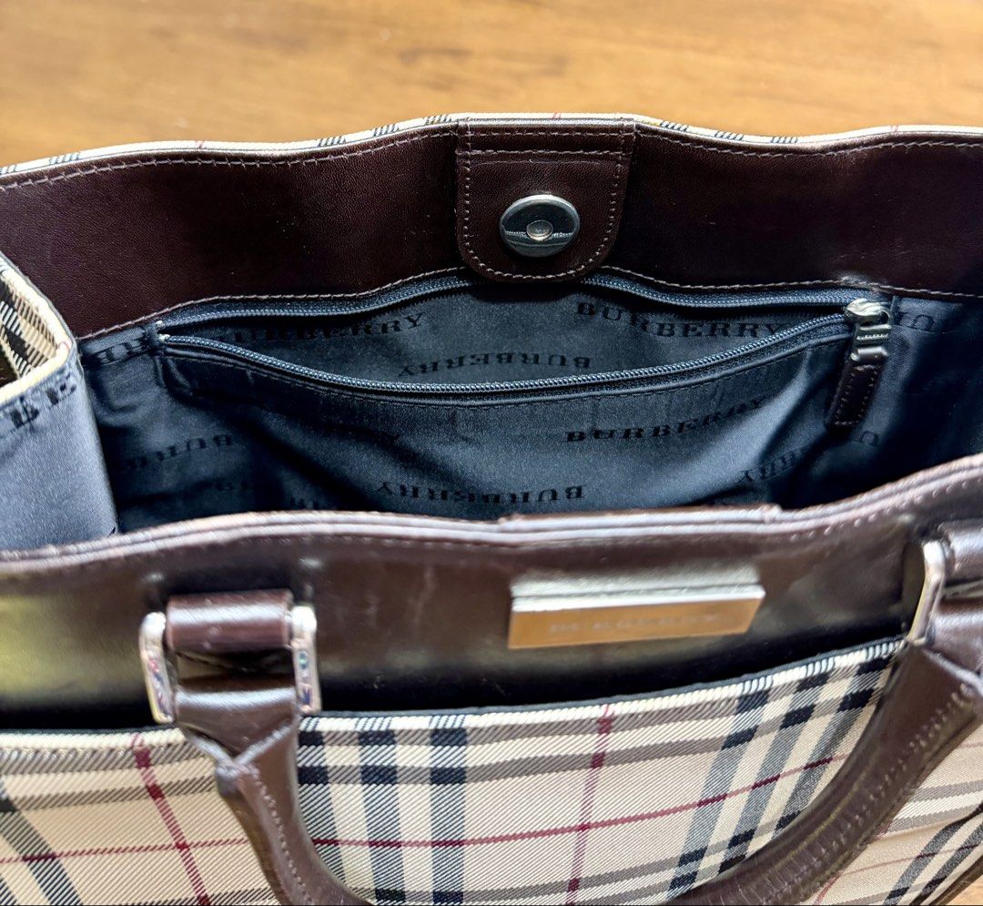 AUTHENTIC BURBERRY HOUSE CHECK CANVASS TOTE (Category: Luxury Bags & Wallets) located in Pasig City. Submitted by the_queen_bee (Listing ID 1467257015, Image 3). Description: No inclusion Clean, No issue Worth 685usd in secondary market (40k+ Php) This tote bag features a canvas body with leather trim, rolled leather handles, an open top with magnetic snap closure, and interior zip and slip pockets. -Color: Beige -Product Materials: Canvas Fabric