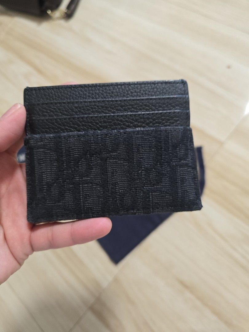 Authentic Dior Oblique lack Card Holder (Category: Luxury Bags & Wallets) located in Cainta. Submitted by dikonaneed (Listing ID 1467201186, Image 3). Description: - Authentic Black Dior card holder bought in dior thailand - Combines premium grained leather with signature Oblique jacquard canvas - Features multiple card slots on one side - Comes complete with original box and dust bag - Condition: Excellent - Mode of Payment: GCash, BPI, or Bank 