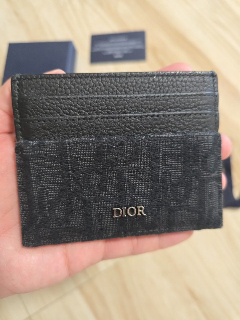 Authentic Dior Oblique lack Card Holder (Category: Luxury Bags & Wallets) located in Cainta. Submitted by dikonaneed (Listing ID 1467201186, Image 2). Description: - Authentic Black Dior card holder bought in dior thailand - Combines premium grained leather with signature Oblique jacquard canvas - Features multiple card slots on one side - Comes complete with original box and dust bag - Condition: Excellent - Mode of Payment: GCash, BPI, or Bank 